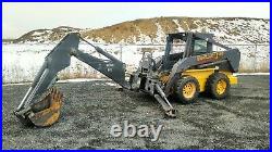 2002 New Holland LS180 Skid Steer. Bobcat with BackHoe Attachment