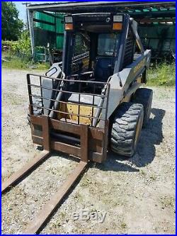 2003 New Holland LS180 Skid Steer with 576 hrs two buckets, forks, augers