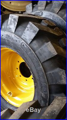(4-Tires with Wheels) New Holland LS 180 230 skidsteer tire size 14-17.5 14175