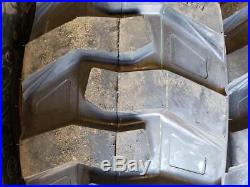 (4- Tires with Wheels) New Holland LS skid-steer tire size 14-17.5 14175