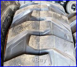 (4- Tires with Wheels) New Holland LS skid-steer tire size 14-17.5 14175