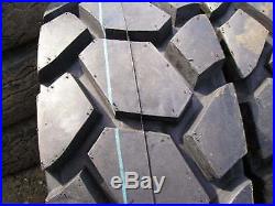 (4-Tires with Wheels) New Holland LS skid-steer tire size 14-17.5 L4 14175