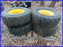 4 Used 14-17.5 FOAM FILLED Skid Steer Tires & Rims for New Holland- Flat proof