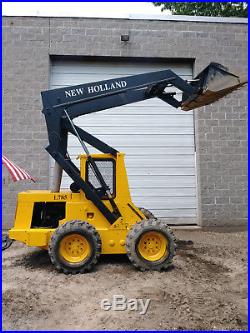 L785 NEW HOLLAND SKID STEER with 62 bucket and 4 cylinder perkins diesel engine