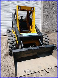 L785 NEW HOLLAND SKID STEER with 62 bucket and 4 cylinder perkins diesel engine