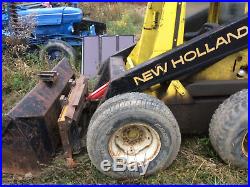NEWHOLLAND SKID STEER L555 with FORKS and BUCKET