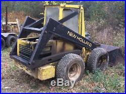 NEWHOLLAND SKID STEER L555 with FORKS and BUCKET