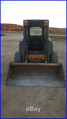 New Holland LS 160 skid steer with attachments (brush hog, new pallet forks)