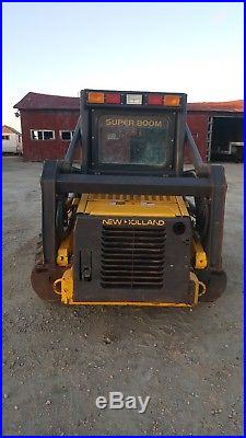 New Holland LS 160 skid steer with attachments (brush hog, new pallet forks)