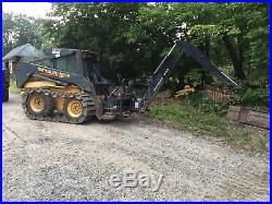 New Holland LS180 Skid steer loader with backhoe attachment