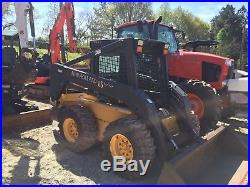 New Holland LS180 Skid steer loader with bucket and forks
