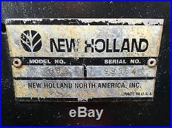 New Holland skid steer LX865 with backhoe attachment New Holland B-104